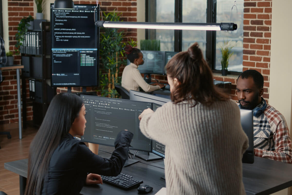Image of a small business employees working at their computers.
